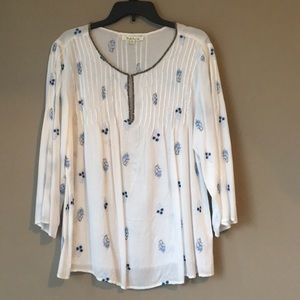 Light summer blouse with blue flower detailing